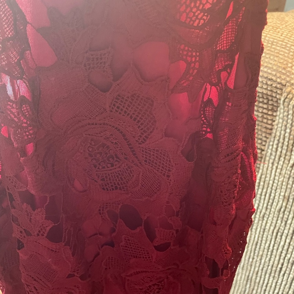 Lace dress with cutaway shoulders.